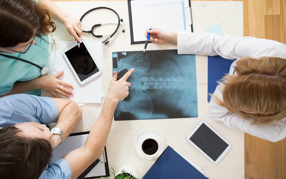 doctors and nurses looking at an x-ray